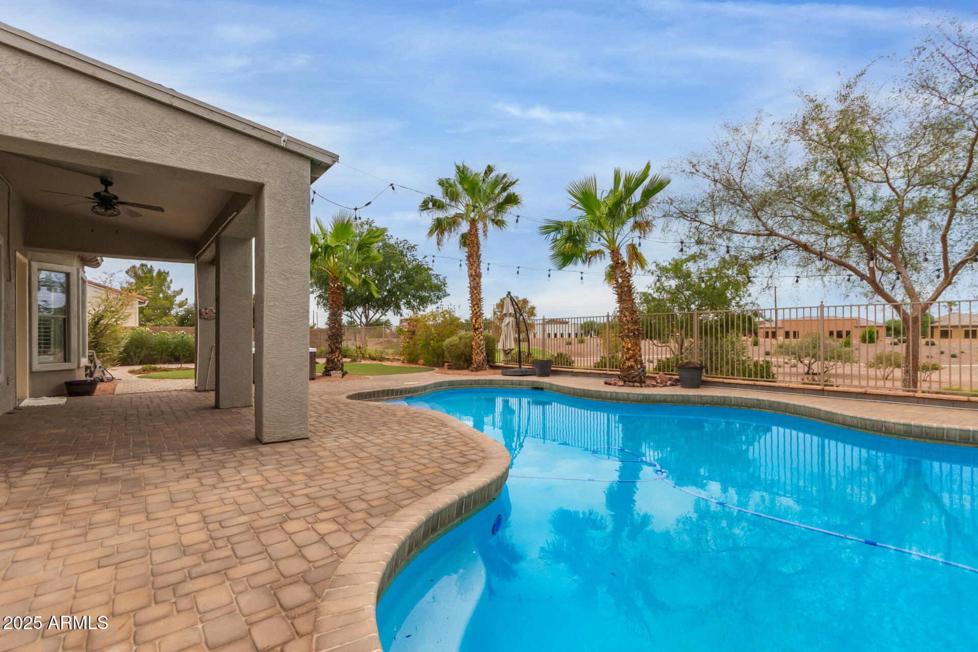 3054 South Colonial Street Gilbert, AZ 85295 - Photo 27 of 29 a view of a swimming pool and lounge chair