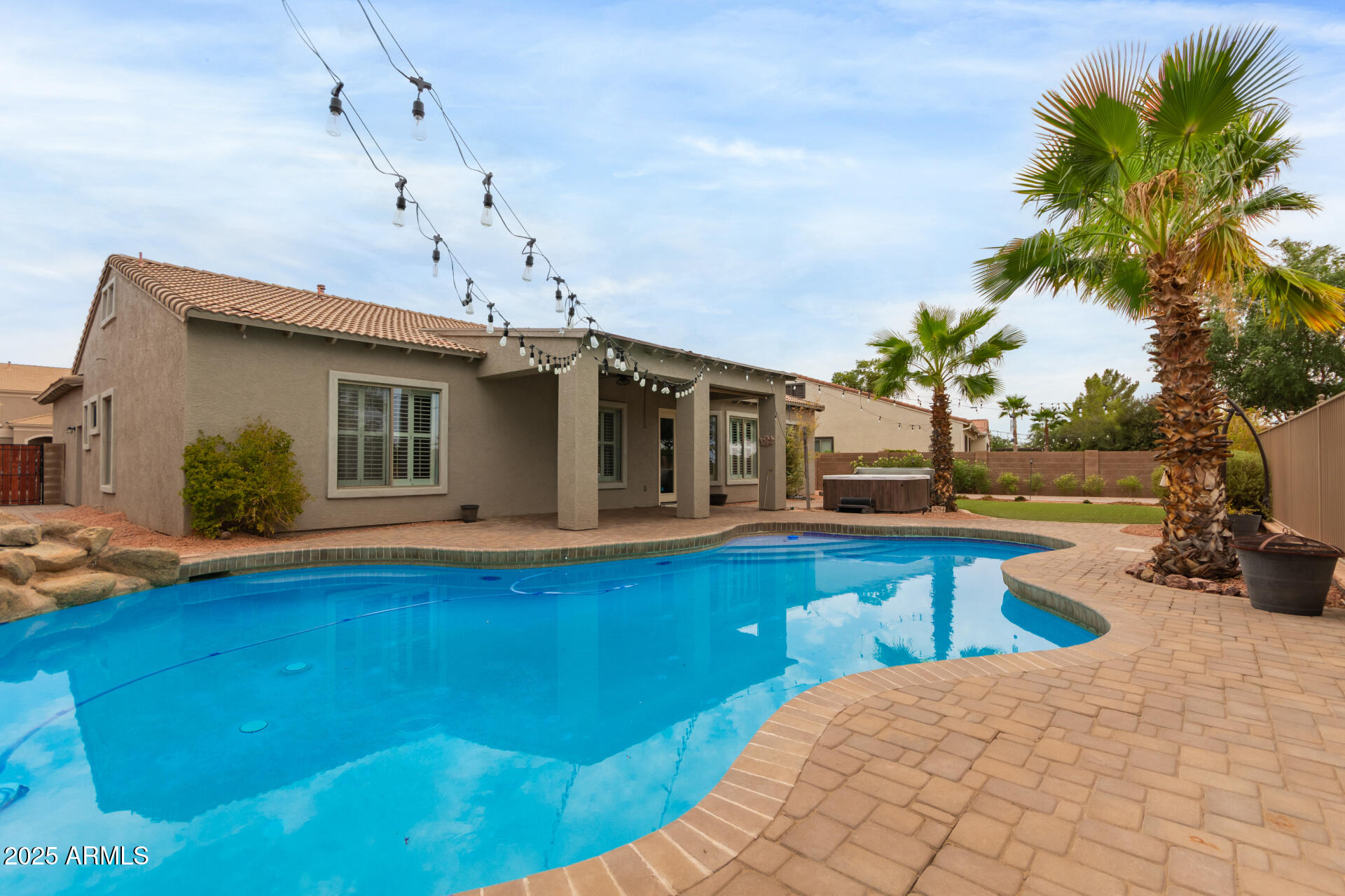 3054 South Colonial Street Gilbert, AZ 85295 - Photo 3 of 29 a view of a house with pool and sitting area