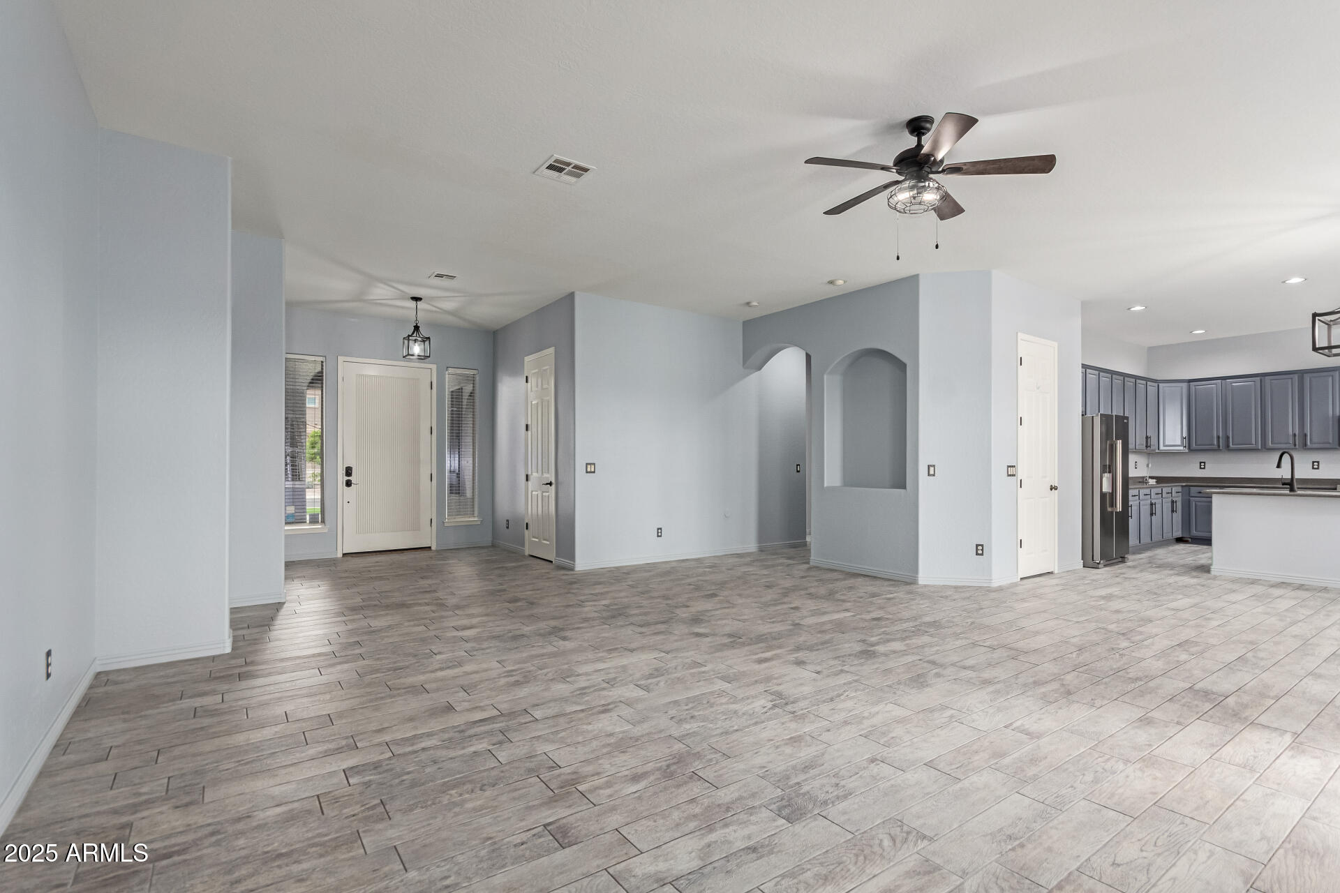 3054 South Colonial Street Gilbert, AZ 85295 - Photo 5 of 29 a view of a kitchen with a sink and cabinet area