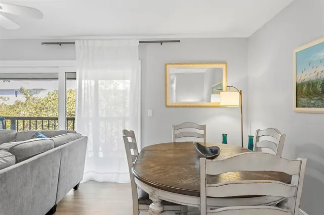 a living room with furniture a large window and a flat screen tv