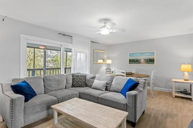 a bathroom with a granite countertop toilet sink and mirror