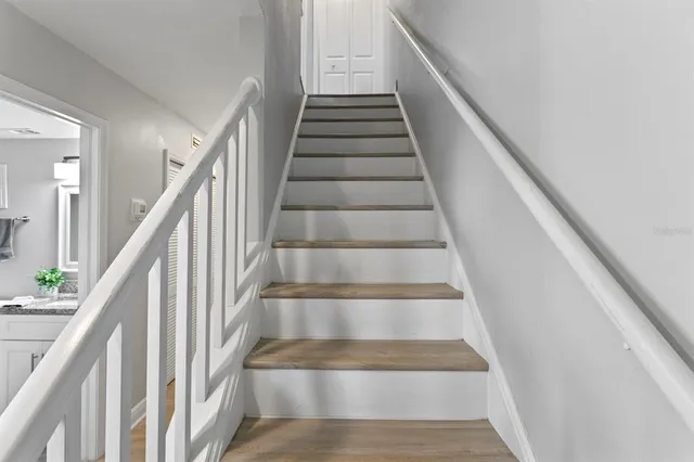 a bedroom with furniture and a flat screen tv