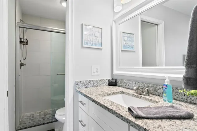 an aerial view of a house with a lake view