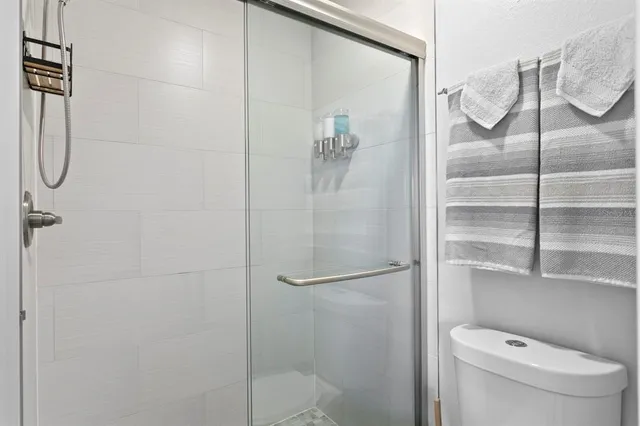 a view of a swimming pool with a lounge chair