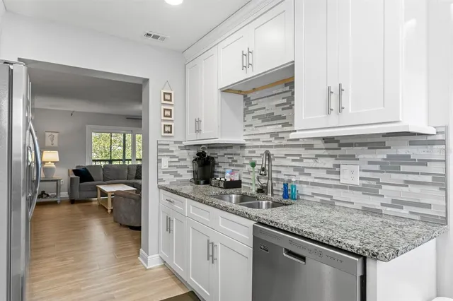 a view of a livingroom with furniture and front door