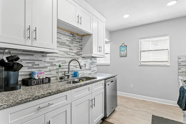 a dining room with furniture and a window