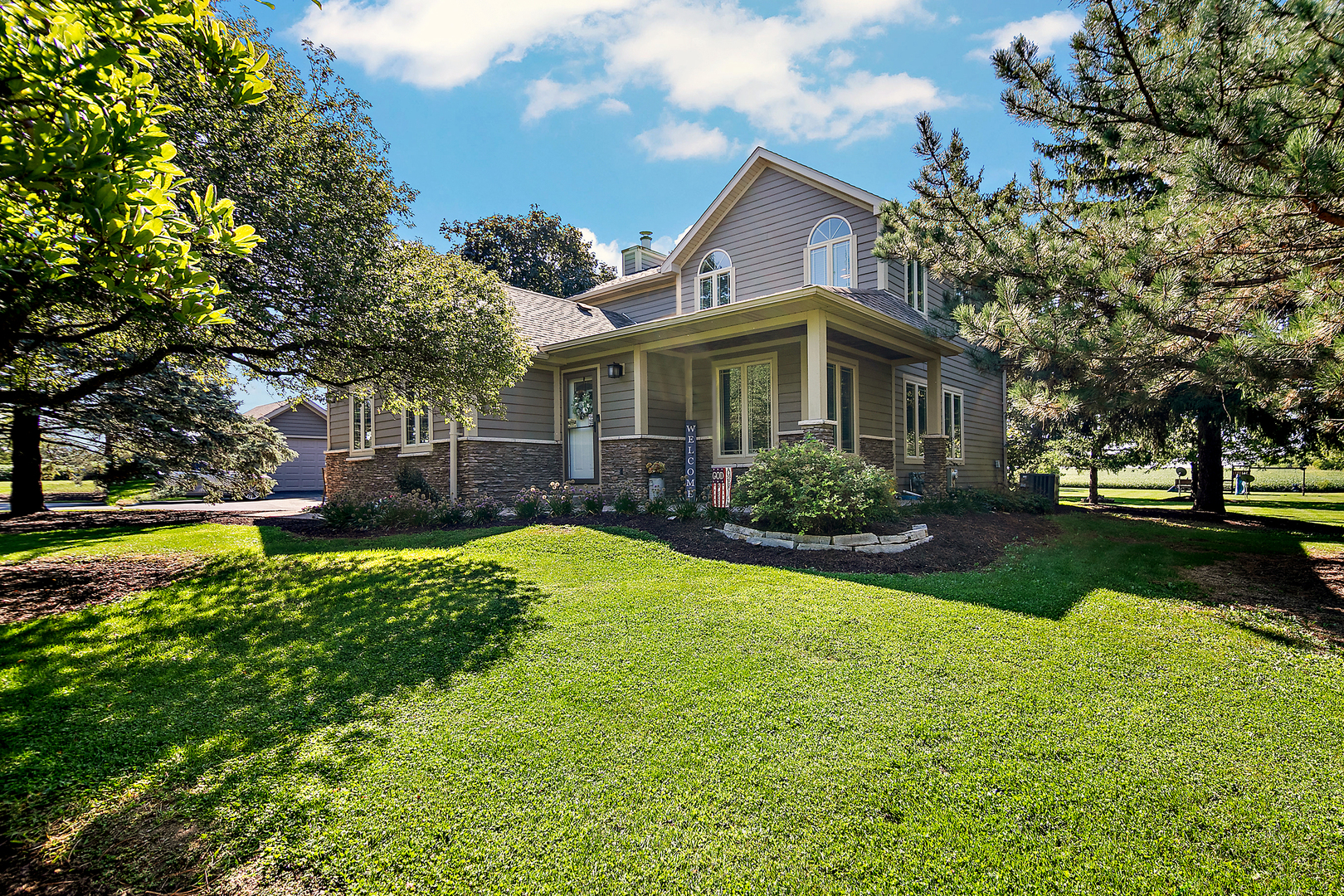 a front view of a house with a yard