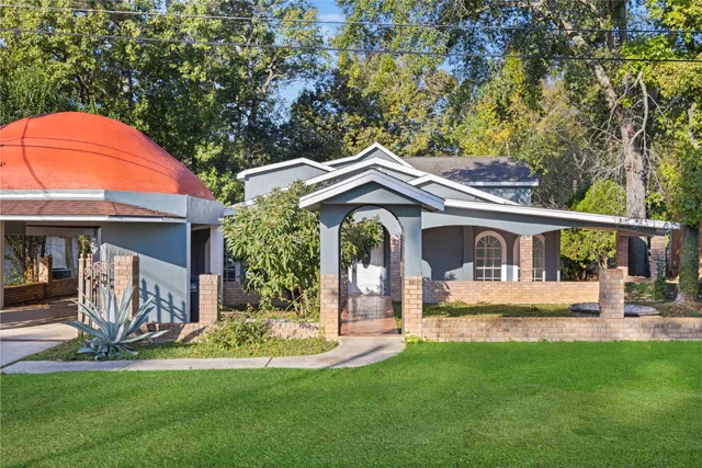 a front view of a house with a yard table and chairs