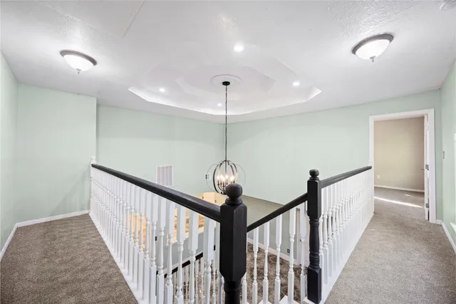 a view of an empty room with a ceiling fan