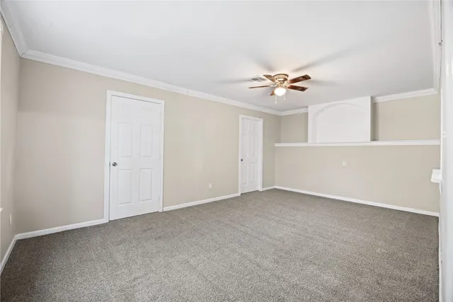 a bathroom with a granite countertop toilet a sink and shower