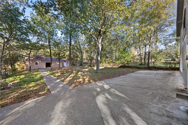 a backyard of a house with lots of green space