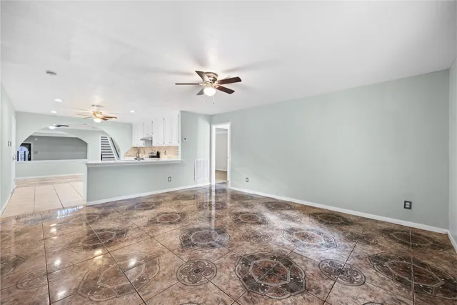 a view of a kitchen with a sink and a stove