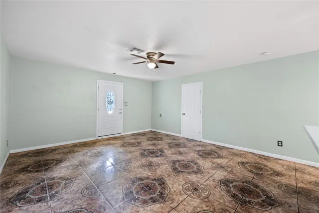 a view of a big room with closet and chandelier fan