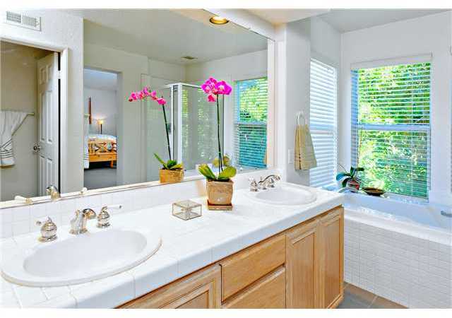4890 Riding Ridge Road San Diego, CA 92130 - Photo 20 of 25 The master bath features a large step in shower, soaking tub, and dual sinks. Walk in closet completes this wonderful master bathroom.