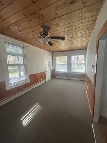 a view of room with a ceiling fan