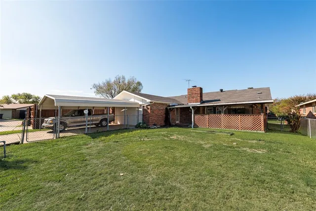a view of a house with pool table and chairs