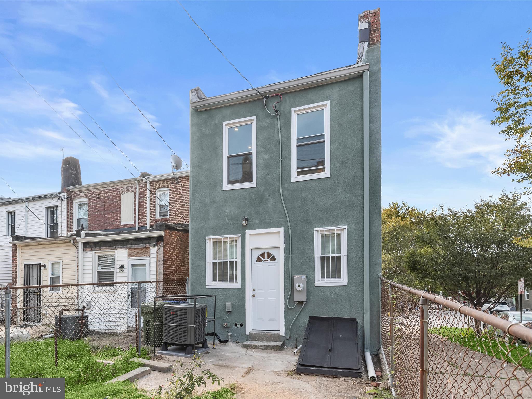 2800 East Chase Street Baltimore, MD 21213 - Photo 30 of 37 a front view of a house with a yard