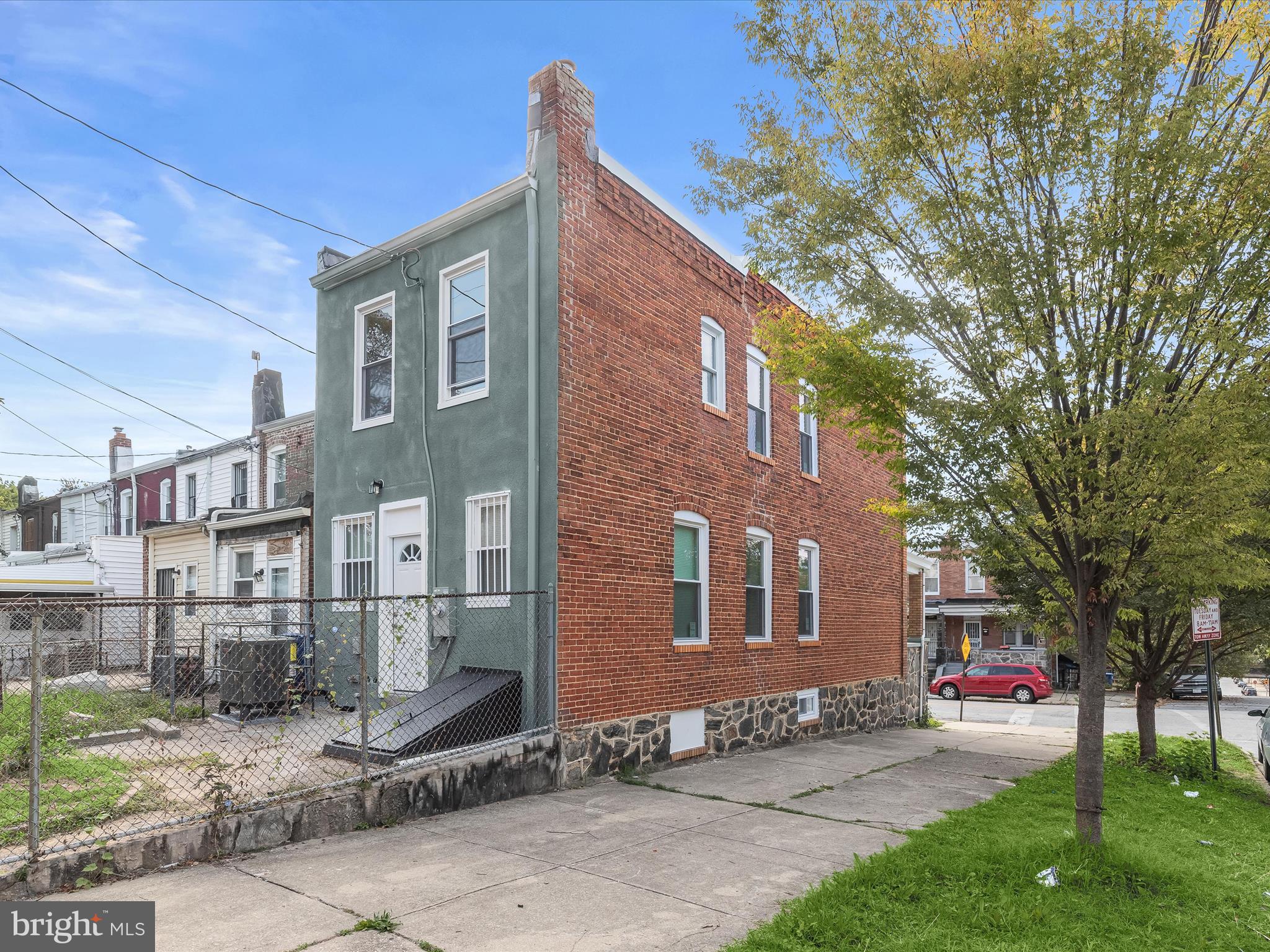 2800 East Chase Street Baltimore, MD 21213 - Photo 32 of 37 a front view of a house with a yard