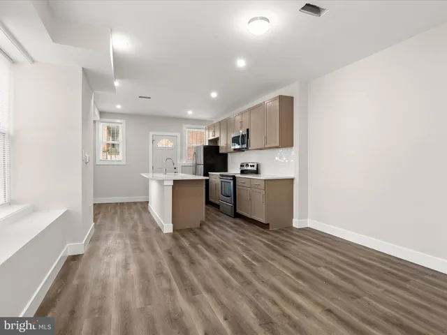 a view of kitchen with wooden floor