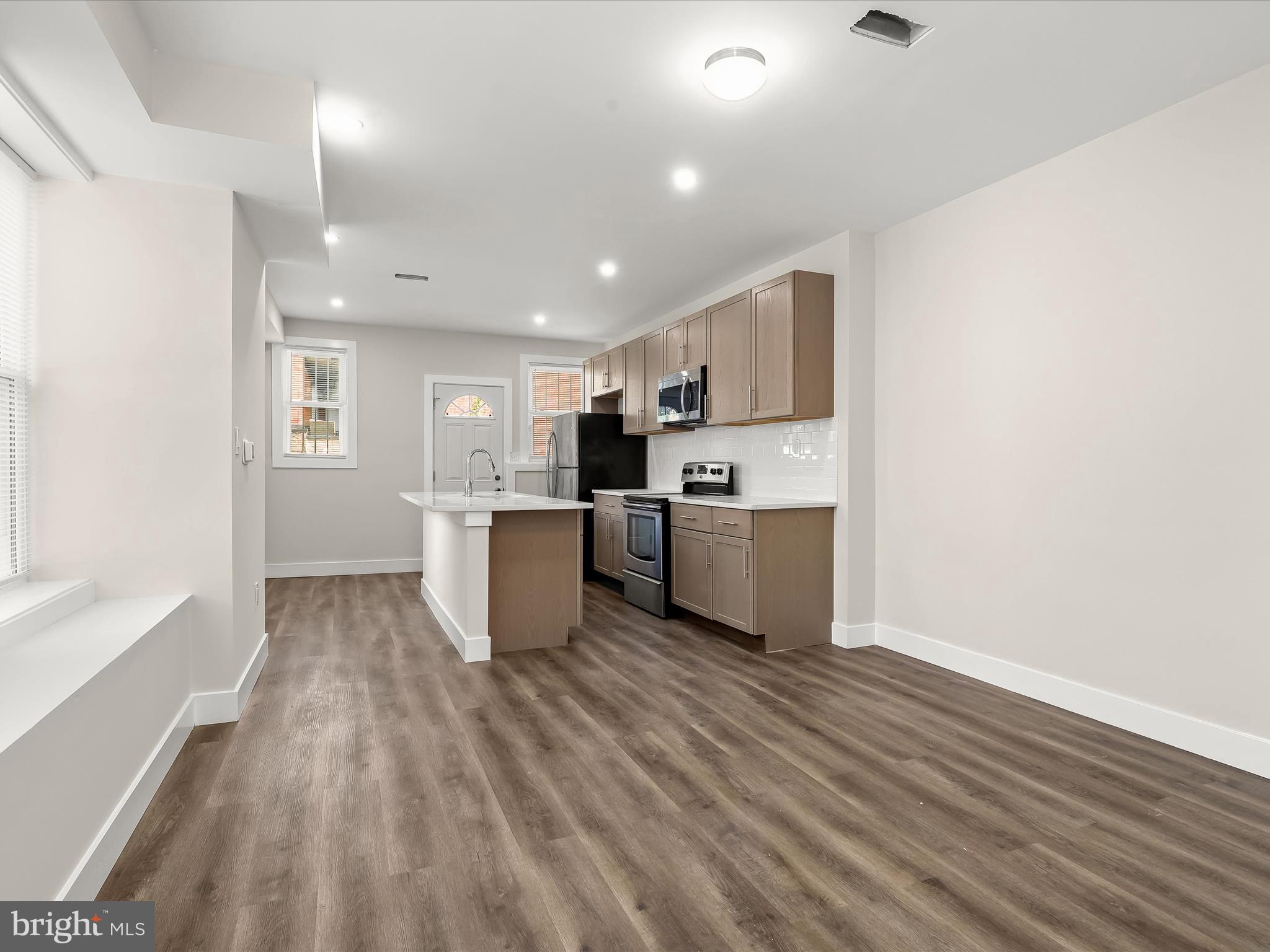 2800 East Chase Street Baltimore, MD 21213 - Photo 9 of 37 a view of kitchen with wooden floor
