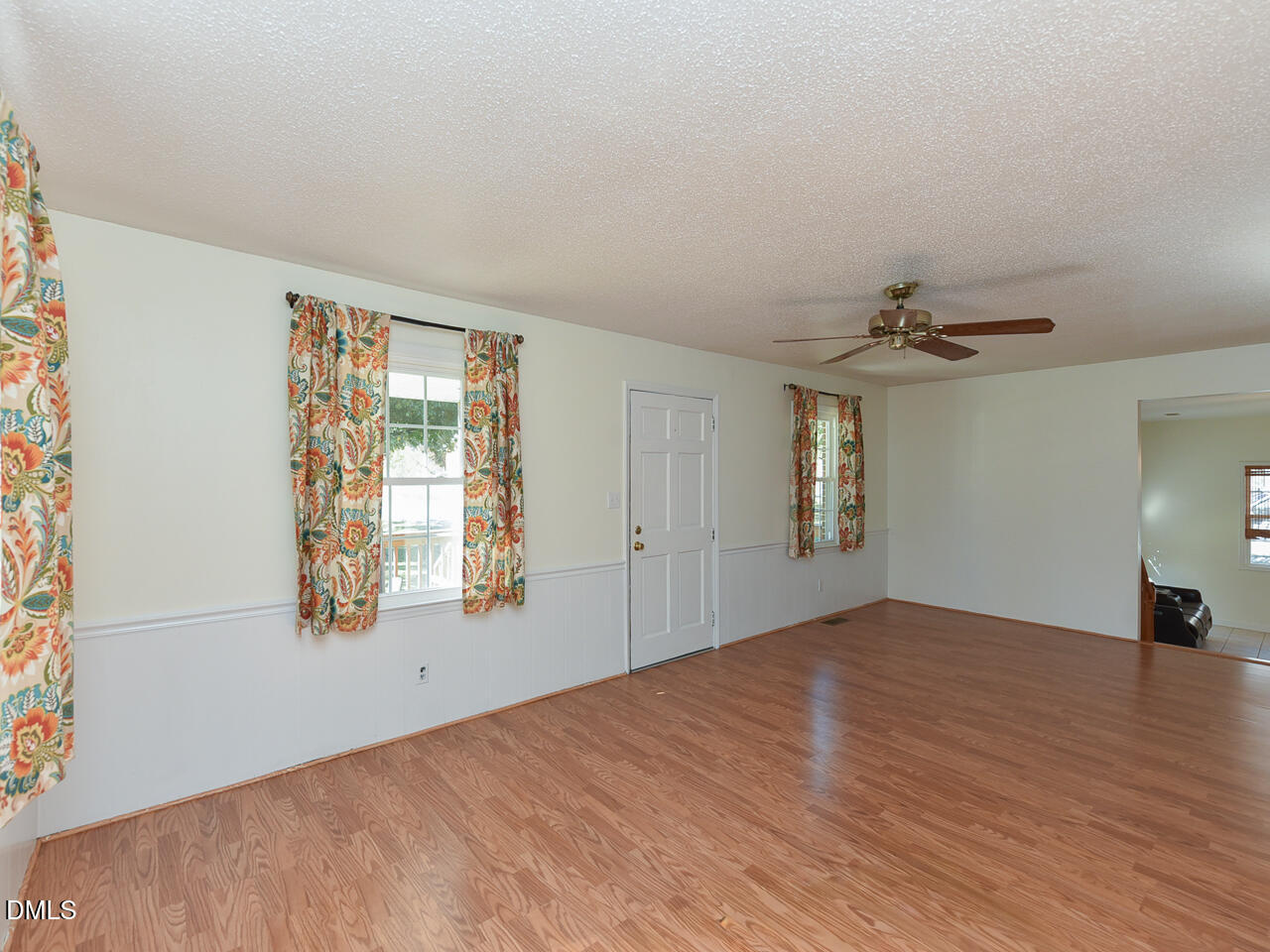 178 Paceville Road Selma, NC 27576 - Photo 15 of 30 a view of empty room with wooden floor and fan