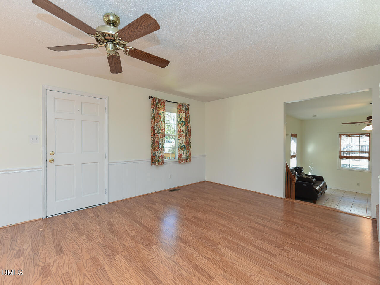 178 Paceville Road Selma, NC 27576 - Photo 16 of 30 a view of empty room with wooden floor and fan