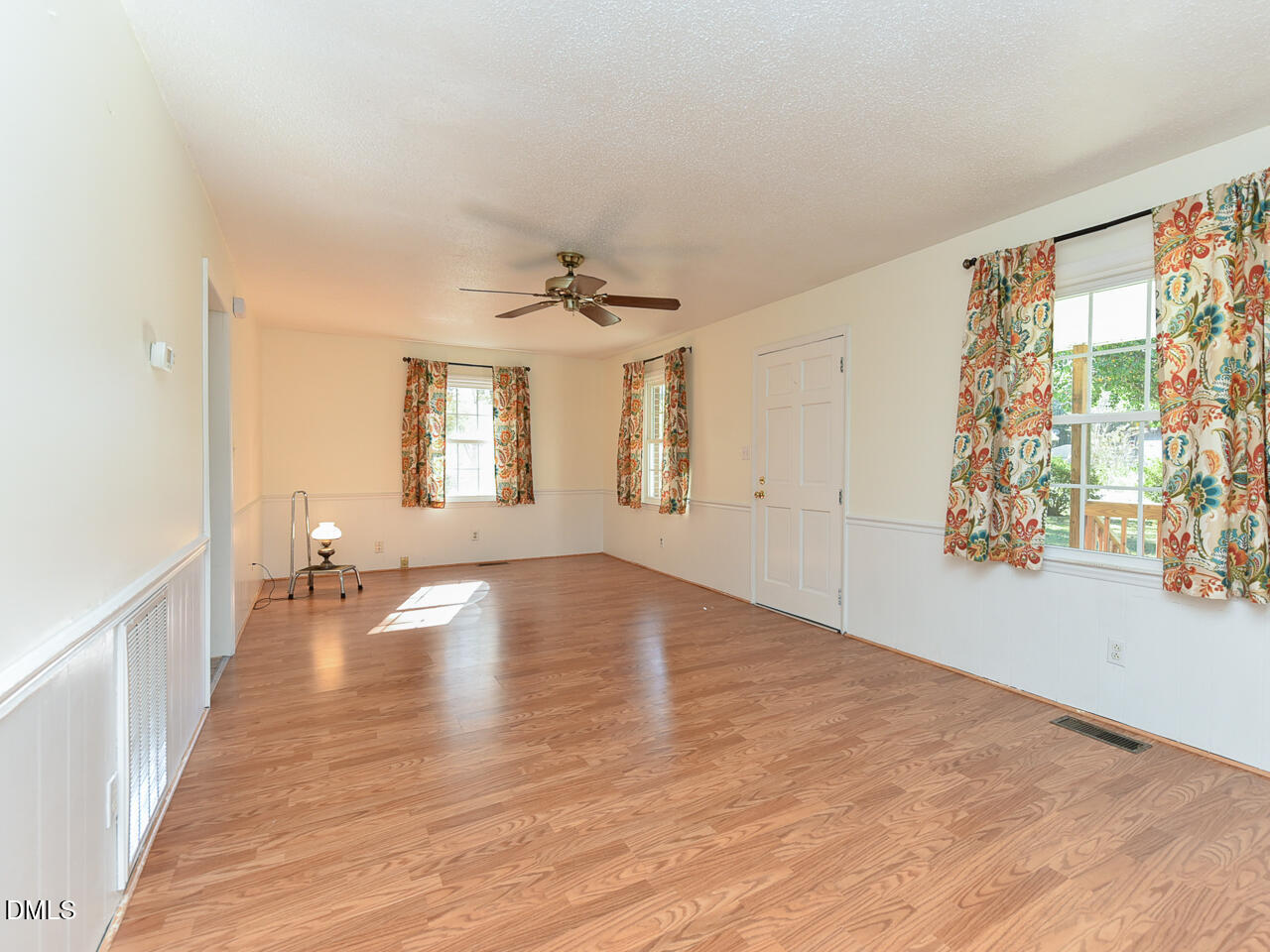 178 Paceville Road Selma, NC 27576 - Photo 17 of 30 a view of empty room with wooden floor and fan