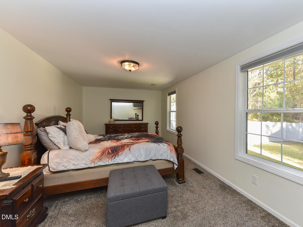 178 Paceville Road Selma, NC 27576 - Photo 19 of 30 a bedroom with a bed and wooden floor