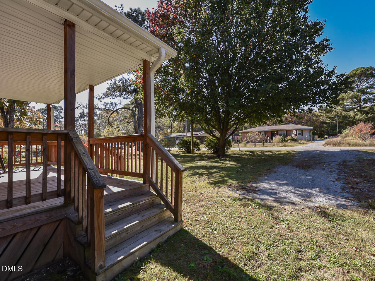 178 Paceville Road Selma, NC 27576 - Photo 5 of 30 a view of a wooden deck and a yard with wooden fence