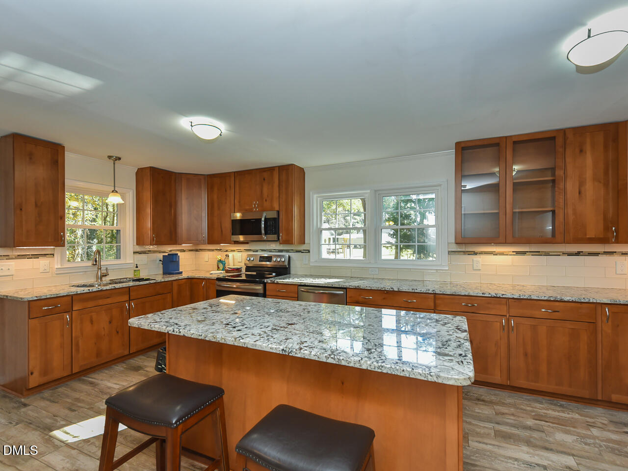178 Paceville Road Selma, NC 27576 - Photo 6 of 30 a kitchen with granite countertop kitchen island sink stove and granite counter top