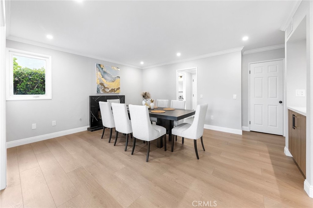 8093 Banyan Street Rancho Cucamonga, CA 91701 - Photo 14 of 65 a view of a dining room with furniture and wooden floor