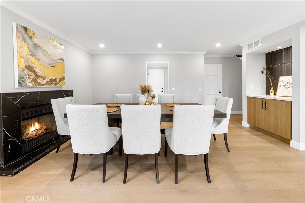 8093 Banyan Street Rancho Cucamonga, CA 91701 - Photo 15 of 65 a view of a dining room with furniture and wooden floor