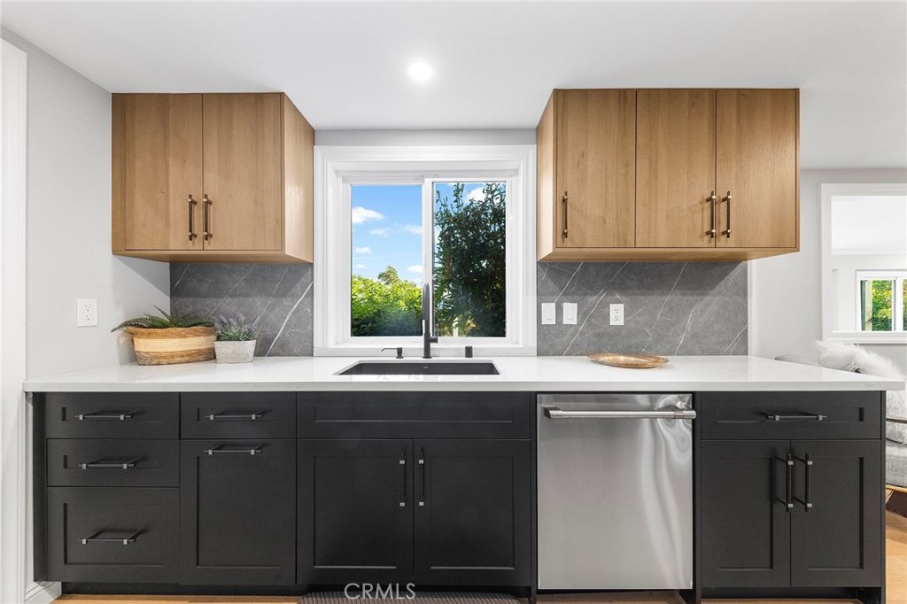 8093 Banyan Street Rancho Cucamonga, CA 91701 - Photo 21 of 65 a kitchen with a sink and cabinets