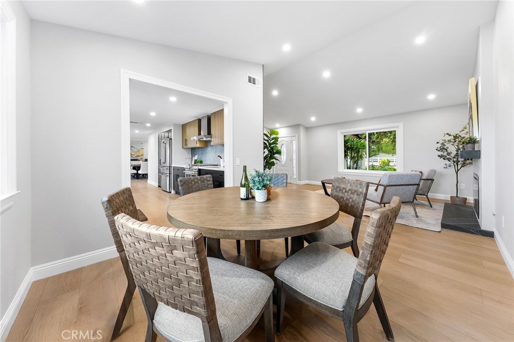 8093 Banyan Street Rancho Cucamonga, CA 91701 - Photo 24 of 65 a view of a dining room with furniture and wooden floor
