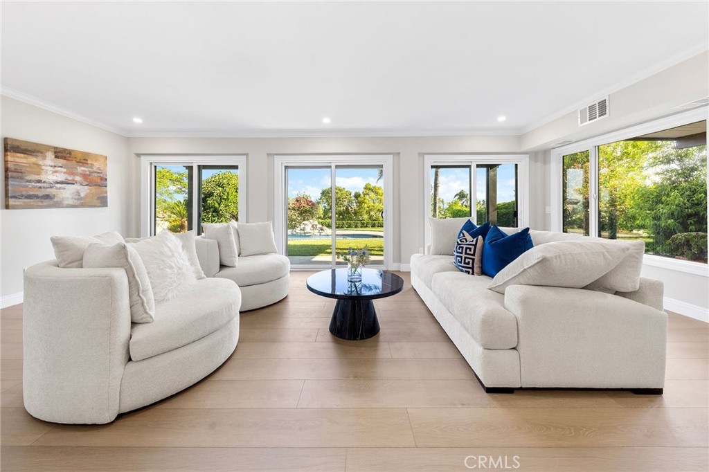 8093 Banyan Street Rancho Cucamonga, CA 91701 - Photo 25 of 65 a living room with fireplace furniture and a large window
