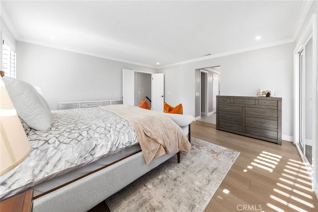 8093 Banyan Street Rancho Cucamonga, CA 91701 - Photo 32 of 65 a bed sitting in a spacious bedroom next to a window and dresser