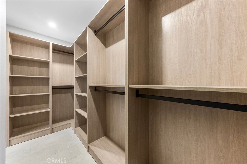 8093 Banyan Street Rancho Cucamonga, CA 91701 - Photo 34 of 65 a view of walk in closet with empty racks