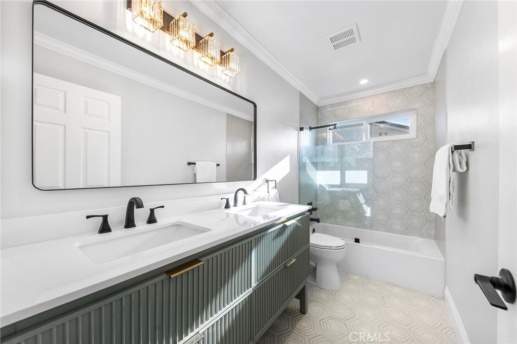 8093 Banyan Street Rancho Cucamonga, CA 91701 - Photo 38 of 65 a bathroom with a double vanity sink mirror double and bathtub