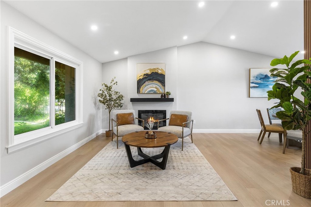 8093 Banyan Street Rancho Cucamonga, CA 91701 - Photo 4 of 65 a living room with furniture and a fireplace