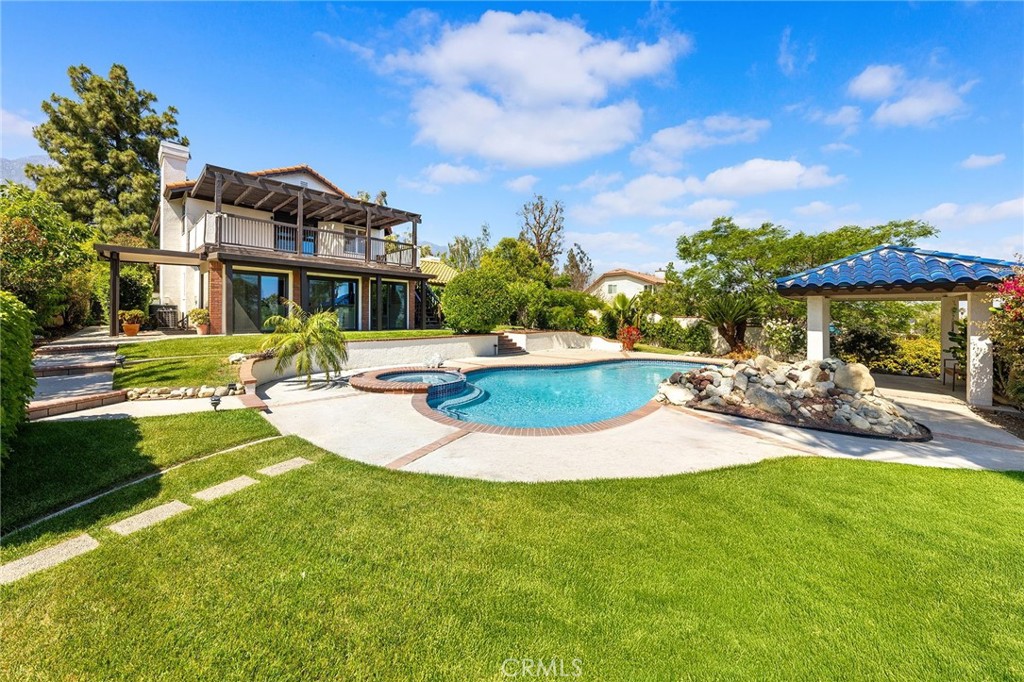 8093 Banyan Street Rancho Cucamonga, CA 91701 - Photo 45 of 65 a view of a house with swimming pool and porch