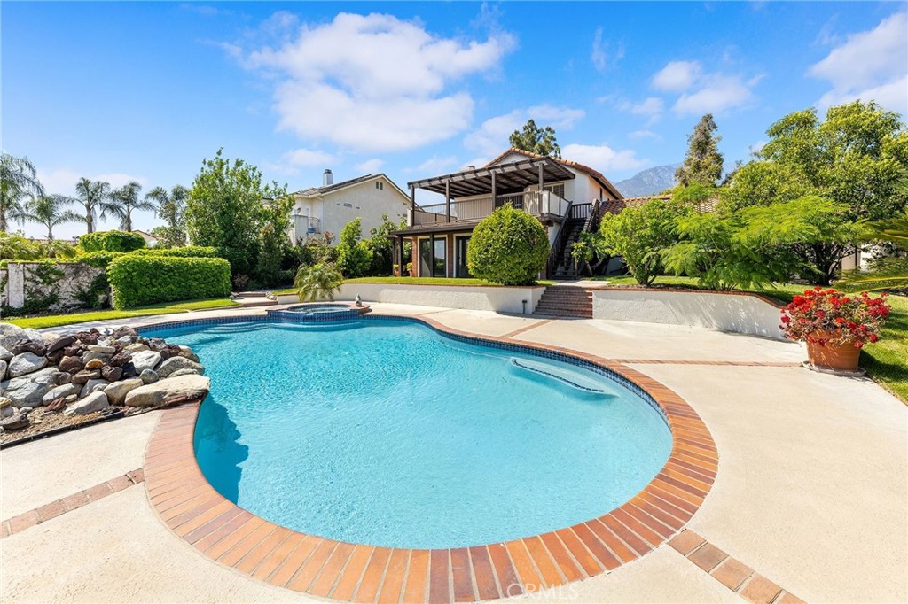 8093 Banyan Street Rancho Cucamonga, CA 91701 - Photo 46 of 65 a view of a swimming pool with an outdoor space