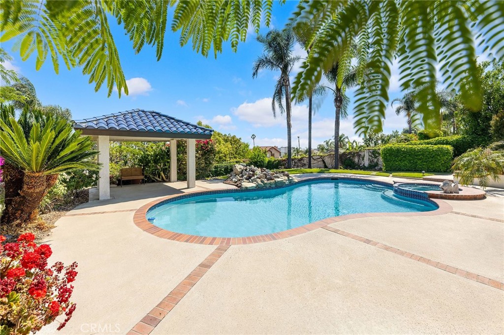 8093 Banyan Street Rancho Cucamonga, CA 91701 - Photo 47 of 65 a swimming pool with outdoor seating and yard