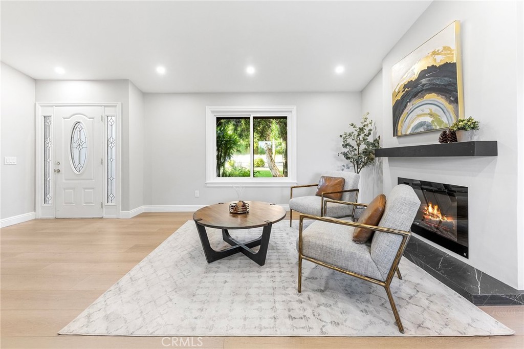 8093 Banyan Street Rancho Cucamonga, CA 91701 - Photo 5 of 65 a living room with furniture and a fireplace
