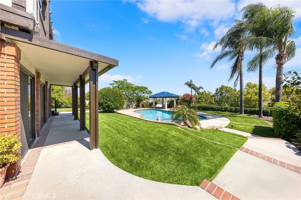 8093 Banyan Street Rancho Cucamonga, CA 91701 - Photo 57 of 65 a view of a backyard with a patio