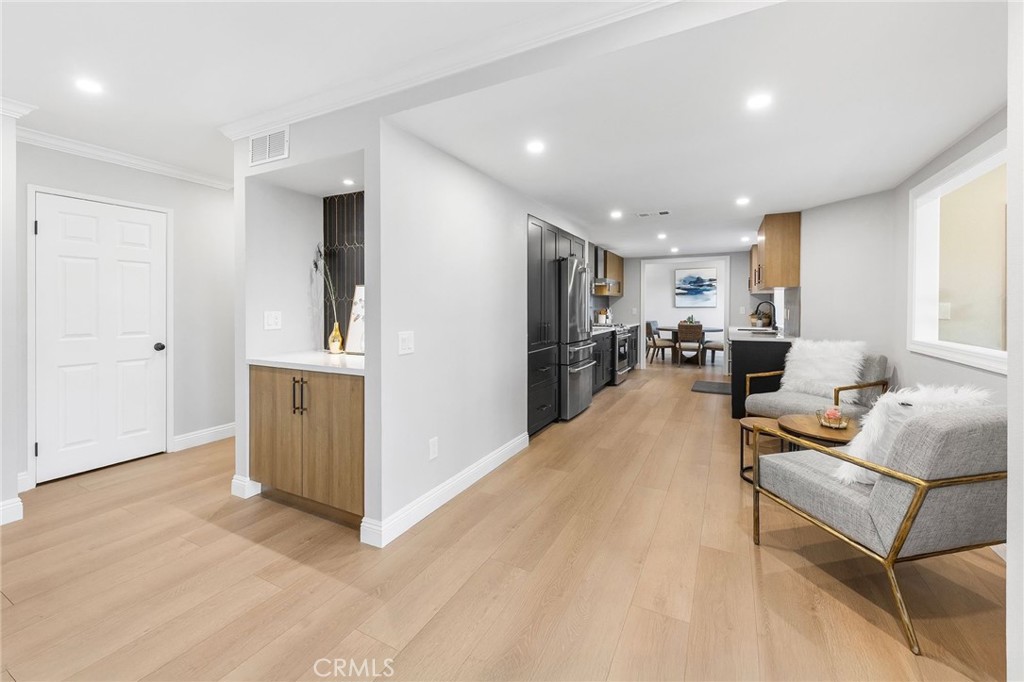 8093 Banyan Street Rancho Cucamonga, CA 91701 - Photo 9 of 65 a living room with furniture and a refrigerator