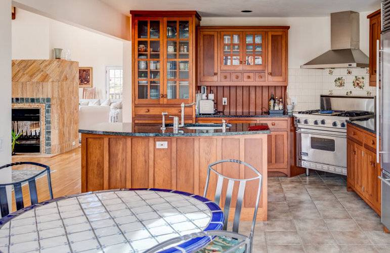491 Butter Lane Bridgehampton, NY 11932 - Photo 12 of 39 a kitchen with stainless steel appliances granite countertop a stove a sink and a refrigerator