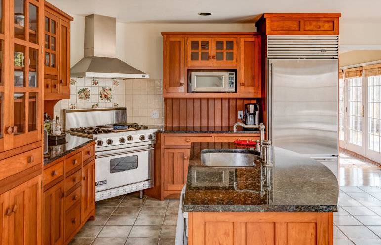 491 Butter Lane Bridgehampton, NY 11932 - Photo 13 of 39 a kitchen with stainless steel appliances granite countertop a stove a sink and a refrigerator
