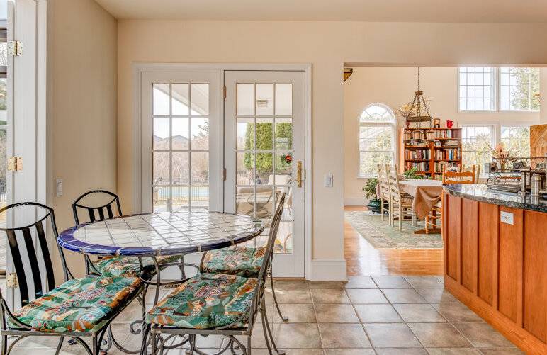 491 Butter Lane Bridgehampton, NY 11932 - Photo 14 of 39 a dining room with furniture and a floor to ceiling window