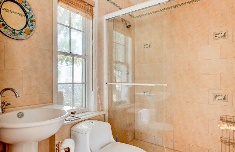 491 Butter Lane Bridgehampton, NY 11932 - Photo 18 of 39 a bathroom with a sink a bathtub and a shower