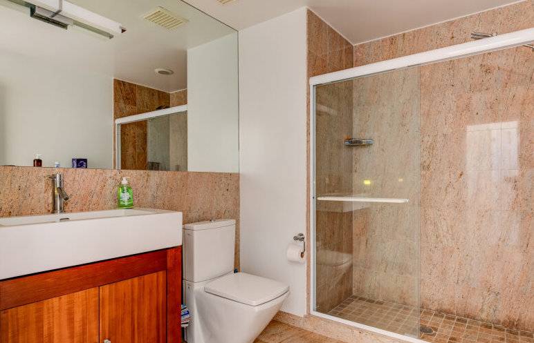 491 Butter Lane Bridgehampton, NY 11932 - Photo 19 of 39 a bathroom with a sink a toilet and shower